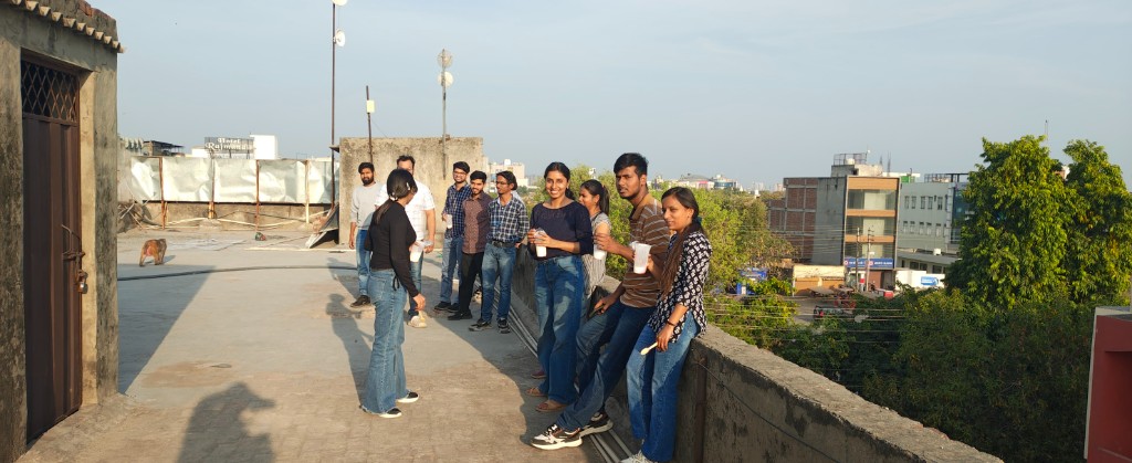 Team on the rooftop at sunset